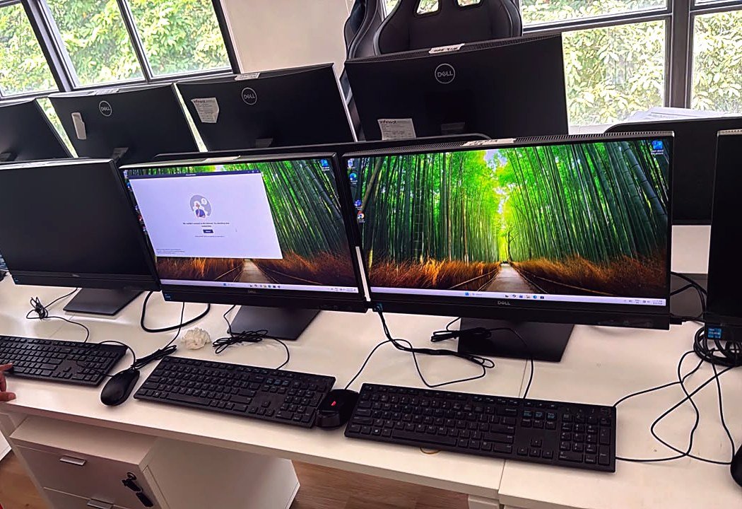 Desktop computers set up for an ICT supply project